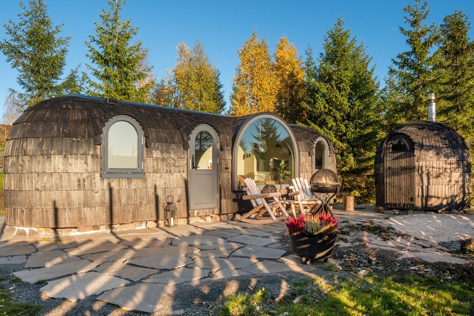 Cabin and sauna in a forested area
